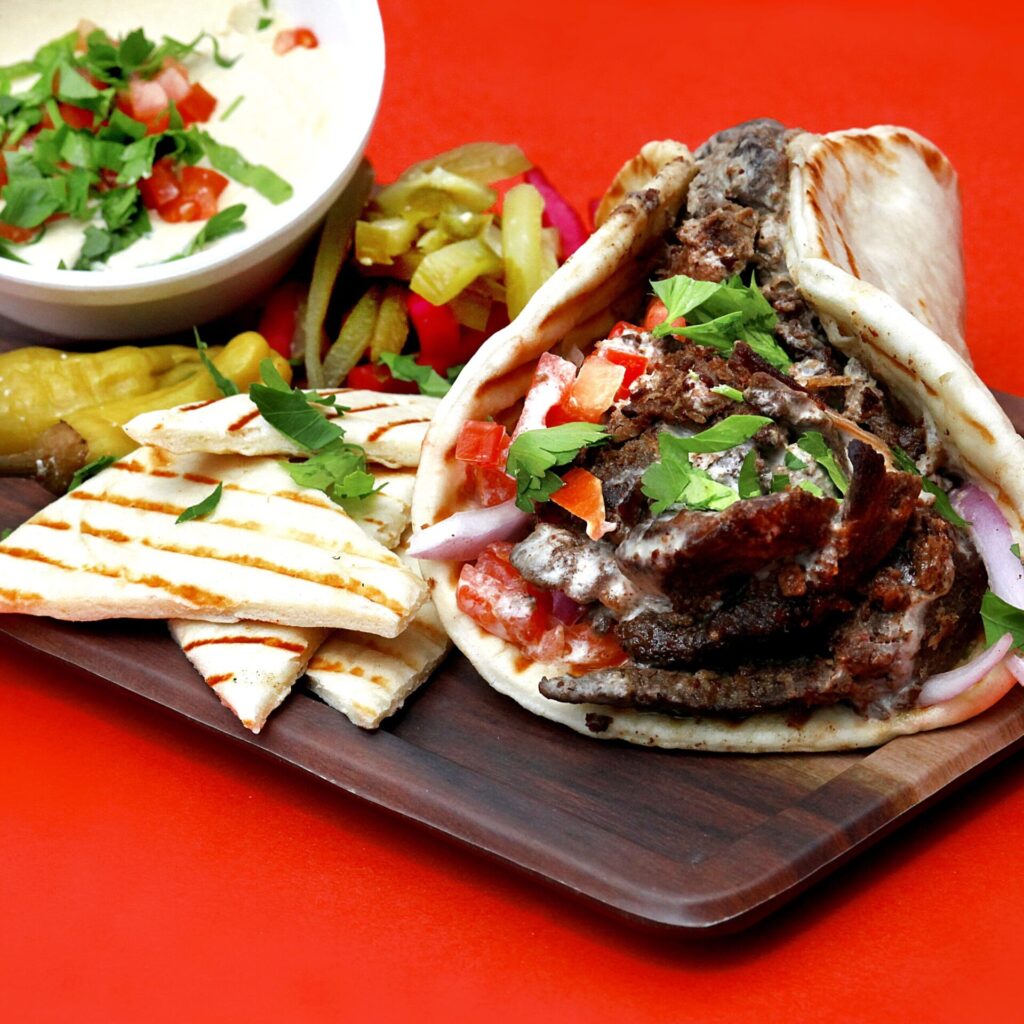 Example of Steak Shawarma, a traditional Mediterranean recipe, with a side of pita bread.